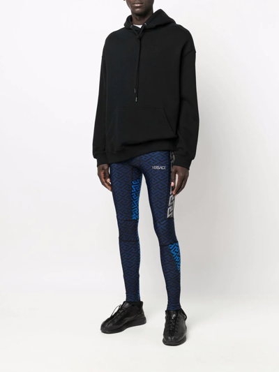Shop Versace All-over Print Leggings In Blau