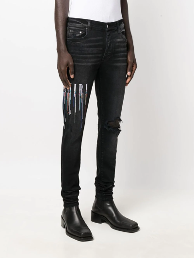 Shop Amiri Logo-embroidered Skinny Jeans In Schwarz