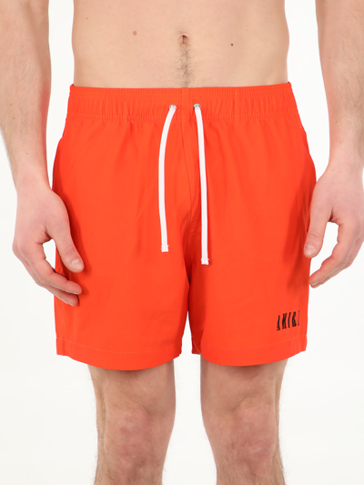 Shop Amiri Logo Printed Drawstring Swim Shorts In Orange
