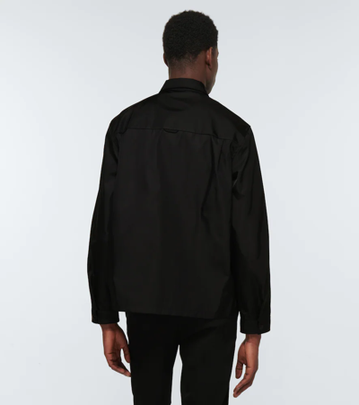 Prada Re-nylon Brand-plaque Recycled-polyamide Shirt In Nero