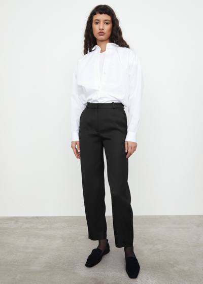 Shop Totême Twisted Seam Cotton Wool Trousers In Black