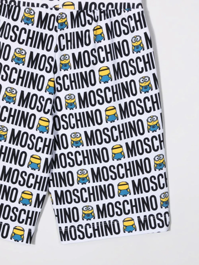 Shop Moschino Minions All-over Logo Print Shorts In White