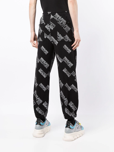 Shop Versace Jeans Couture All-over Logo Track Pants In Black