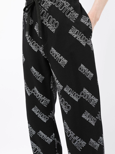 Shop Versace Jeans Couture All-over Logo Track Pants In Black