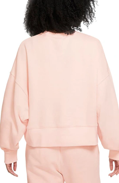 Shop Nike Sportswear Essential Oversize Sweatshirt In Pale Coral/ White