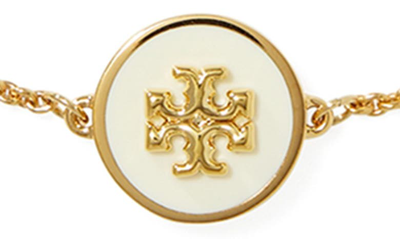 Shop Tory Burch Kira Enamel Pendant Chain Bracelet In Tory Gold / New Ivory