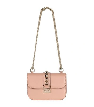 Shop Valentino Small Rockstud Lock Bag In Sorbet Blush