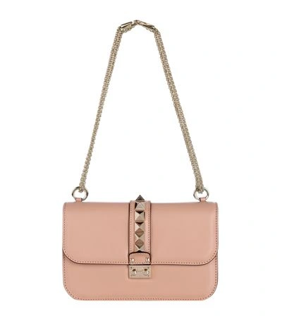 Shop Valentino Medium Rockstud Lock Bag In Sorbet Blush