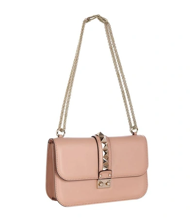 Shop Valentino Medium Rockstud Lock Bag In Sorbet Blush