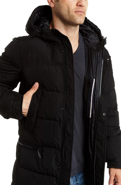 Shop Vince Camuto Long Hooded Parka In Black