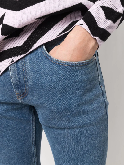 Shop Versace Straight-leg Greca-print Jeans In Blue