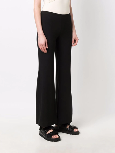 Rodebjer Flared Mid-rise Trousers In Black