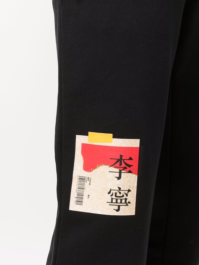 Shop Li-ning Logo-print Detail Track Pants In Black