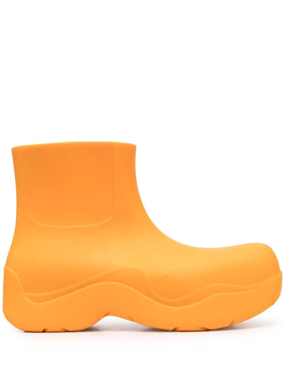 Shop Bottega Veneta Puddle Ankle Boots In Orange
