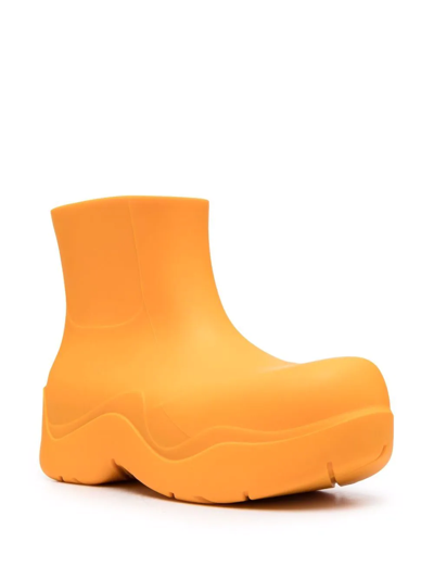 Shop Bottega Veneta Puddle Ankle Boots In Orange