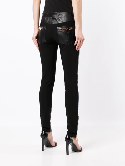 Shop Versace Panelled Skinny Trousers In Black