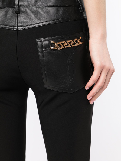 Shop Versace Panelled Skinny Trousers In Black