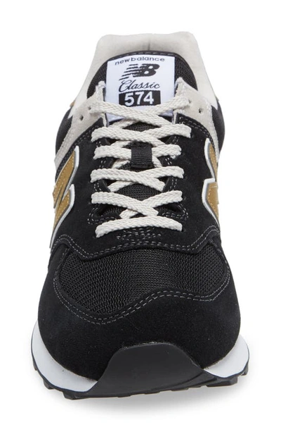Shop New Balance 574 Classic Sneaker In Black/ Tan
