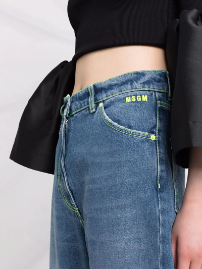 Shop Msgm Faded-effect Wide-leg Jeans In Blue