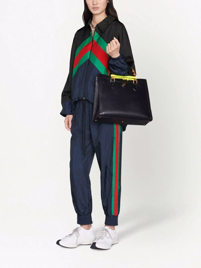 Shop Gucci Stripe-detail Track Pants In Blau