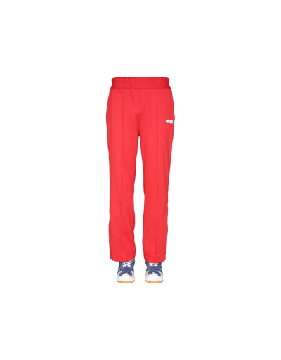 Shop Gcds Jogging Pants With Chain Print In Red