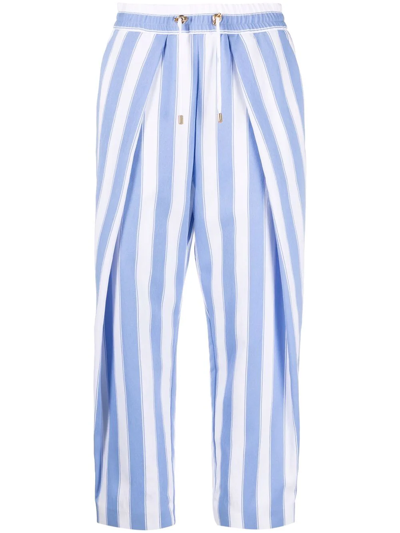 Shop Balmain Striped Drawstring Cropped Trousers In Blau