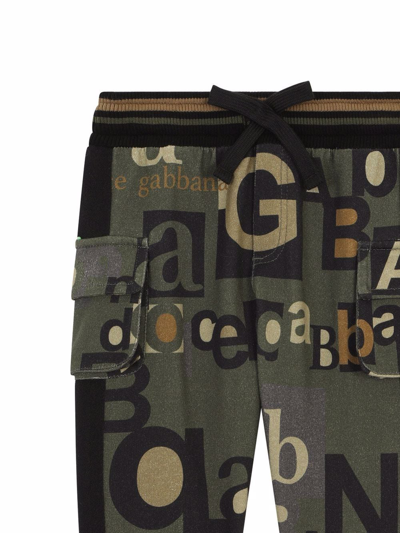 Shop Dolce & Gabbana All Over Logo-print Track Trousers In Green