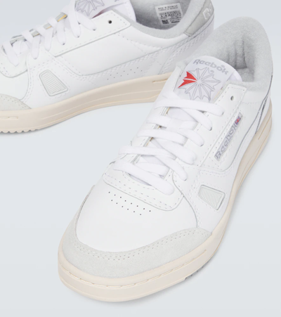 Shop Reebok Lt Court Leather Sneakers In Ftwwht/pugry3/alabas