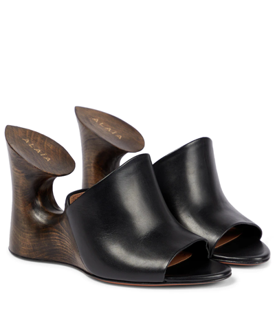 Shop Alaïa Leather Mules In Noir