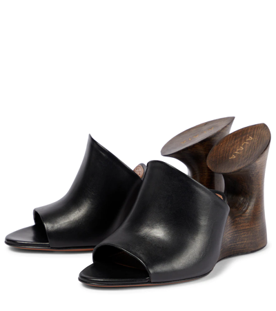 Shop Alaïa Leather Mules In Noir