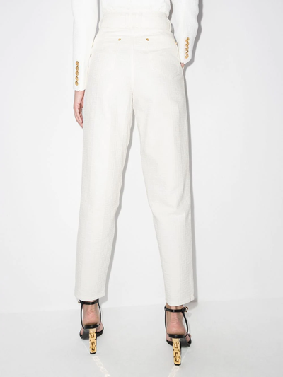 Shop Balmain Monogram-print Logo-buckle High-waisted Jeans In Weiss