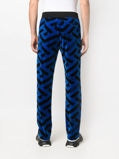 Shop Versace Geometric-pattern Track Pants In Schwarz