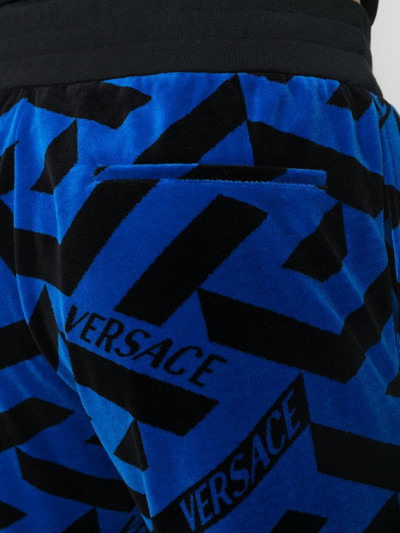 Shop Versace Geometric-pattern Track Pants In Schwarz
