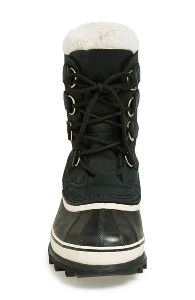 Shop Sorel Caribou™ Wp Boot In Black/ Stone