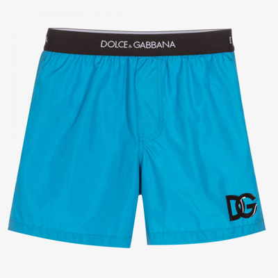 Shop Dolce & Gabbana Boys Blue Logo Swim Shorts