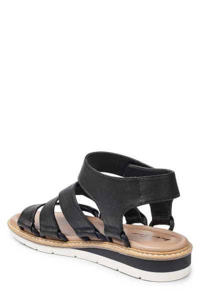 Shop Adam Tucker Gladiator Loop Sandal In Black Vachetta