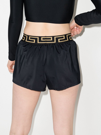 Shop Versace Greca-waistband Shorts In Schwarz