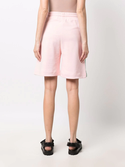 Shop Msgm Tape-detail Flared Track Shorts In Rosa