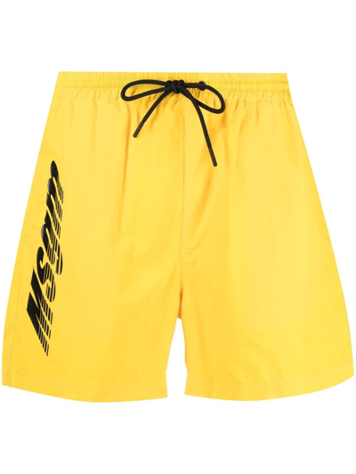 Shop Msgm Logo-print Swim Shorts In Gelb