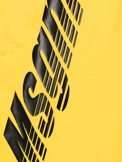 Shop Msgm Logo-print Swim Shorts In Gelb