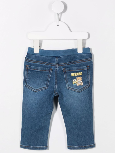 Shop Moschino Minion-teddy Logo-print Jeans In Blue