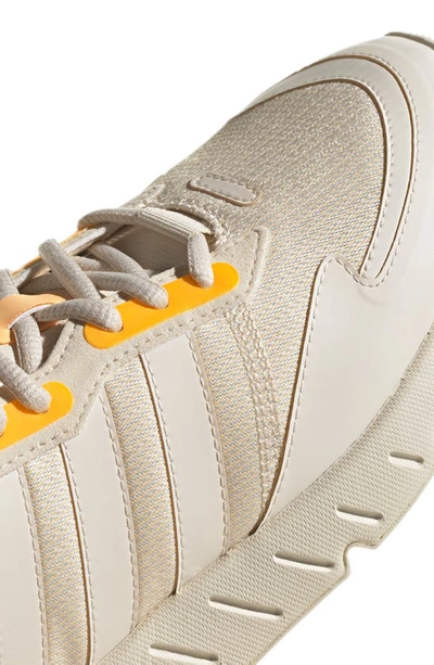 Shop Adidas Originals Zx 1k Boost Sneaker In Wonder White/ Acid Orange
