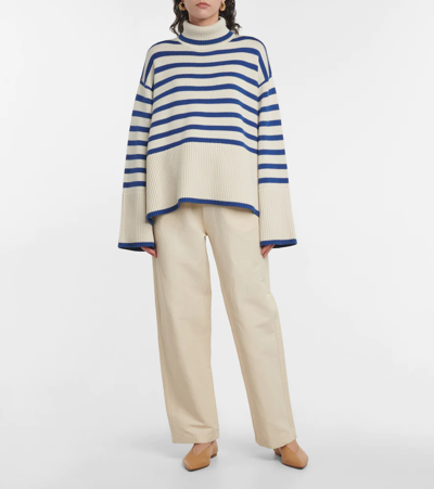 Shop Totême Striped Wool And Cotton Sweater In Off White Stripe