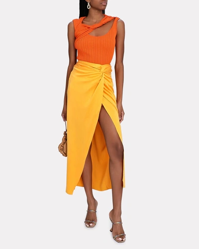 Shop Aknvas Alba Twisted Cut-out Rib Knit Top In Orange