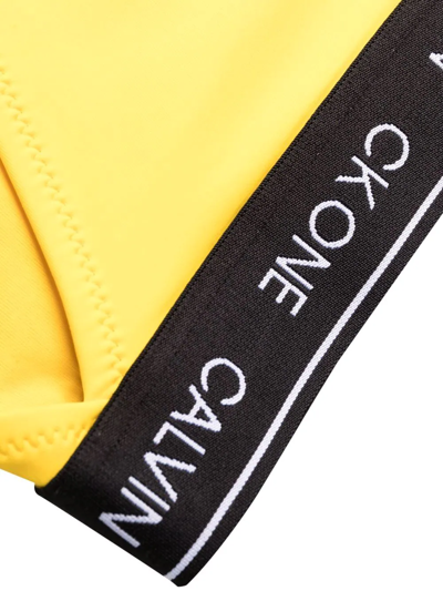 Shop Calvin Klein Logo-waistband Bikini Bottoms In Yellow