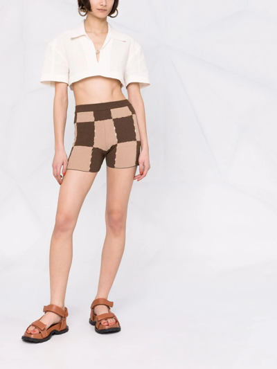 Shop Jacquemus Cut-out Checkerboard Knitted Shorts In Brown