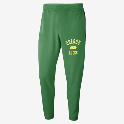 Shop Nike Men's College Dri-fit Spotlight (oregon) Pants In Green