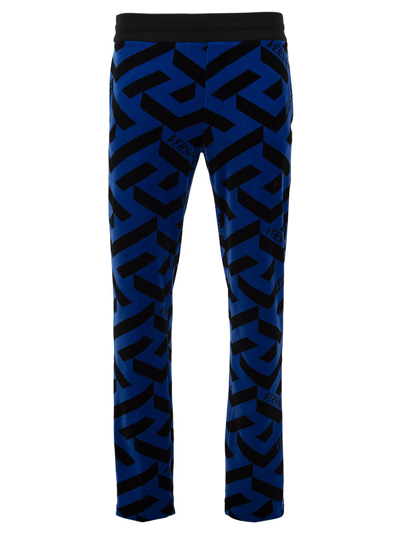 Shop Versace Monogram Track Pants In Blue