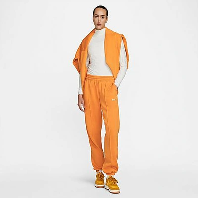 Shop Nike Women's Sportswear Essential Fleece Jogger Pants In Light Curry/white