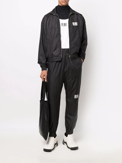 Shop Vtmnts Barcode-print Track Pants In Black